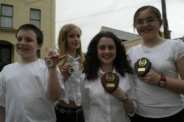 McGinley School of Music pupils who came first and second in the under 15 yrs singing duet at Moville Feis. Included are Aaron Deery and Eibhlin O'Kane (2nd) and Rebecca O'Doherty and Christina Tedders (1st). (0405JB65) :Winners at the Moville Feis in 2004.:Moville Feis 2004