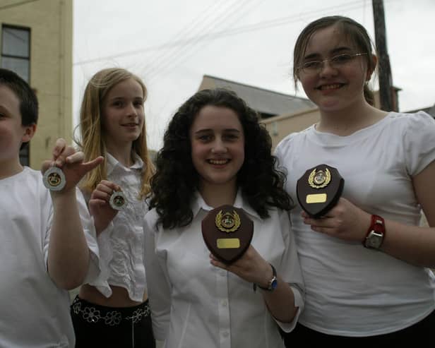 McGinley School of Music pupils who came first and second in the under 15 yrs singing duet at Moville Feis.  Included are Aaron Deery and Eibhlin O'Kane (2nd) and Rebecca O'Doherty and Christina Tedders (1st).  (0405JB65)		:Winners at the Moville Feis in 2004.:Moville Feis 2004