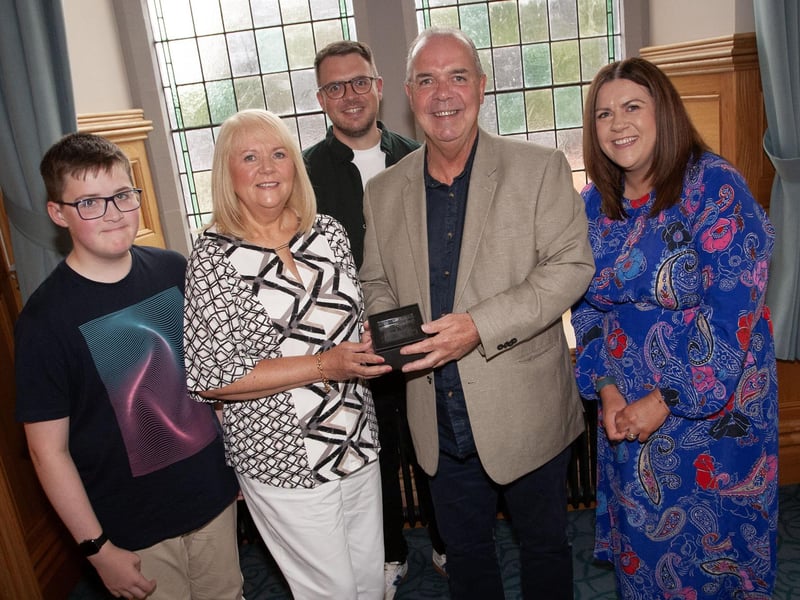 Retired bus driver Andy McGillan pictured with his family at the Guildhall on Thursday evening.
