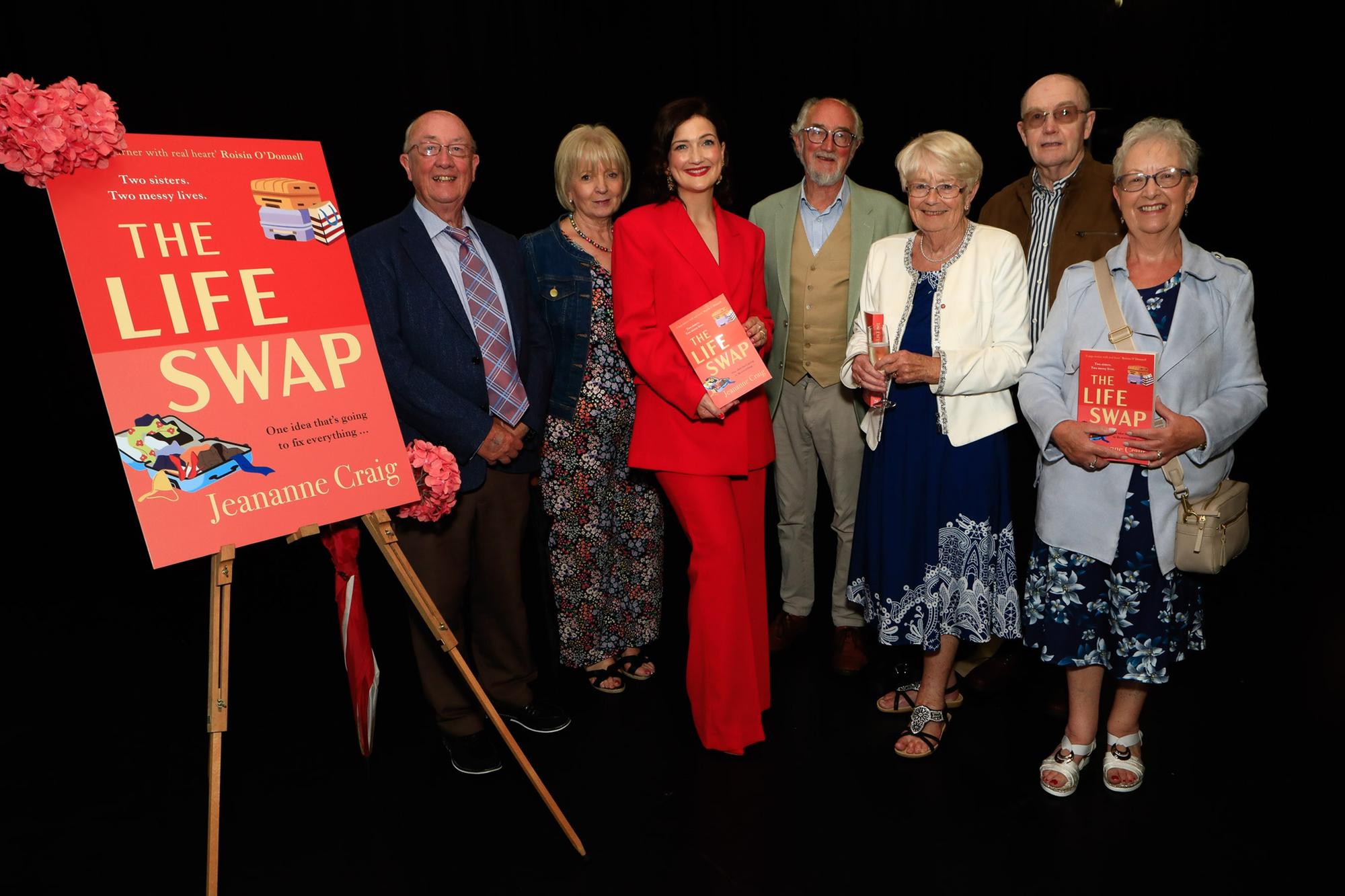 Jeananne Craig, author with dad Jim, uncles and aunts at the launch of her first novel, published by Hachette Books Ireland, “The Life Swap”.  (Photo - Tom Heaney, nwpresspics)