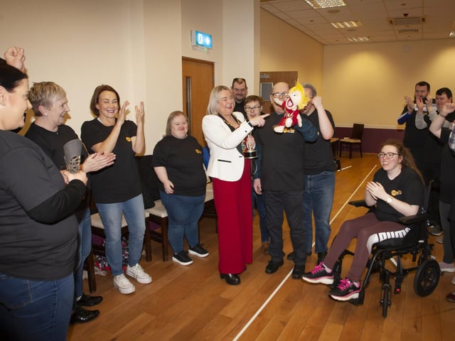 The Mayor is presented with a puppet of herself by the Stage Beyond Theatre Company during a visit to the group at the Millennium Forum on Monday morning.