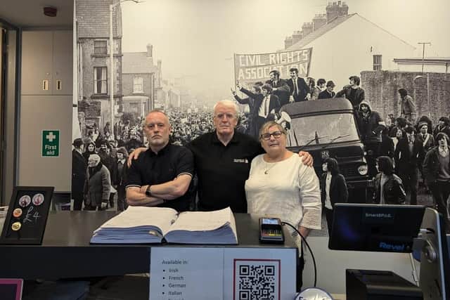 John Kelly with the manager of the Museum of Free Derry, Adrian Kerr, and colleague Jean Hegarty, whose brother 17-year-old brother Kevin McElhinney was shot dead on Bloody Sunday.
