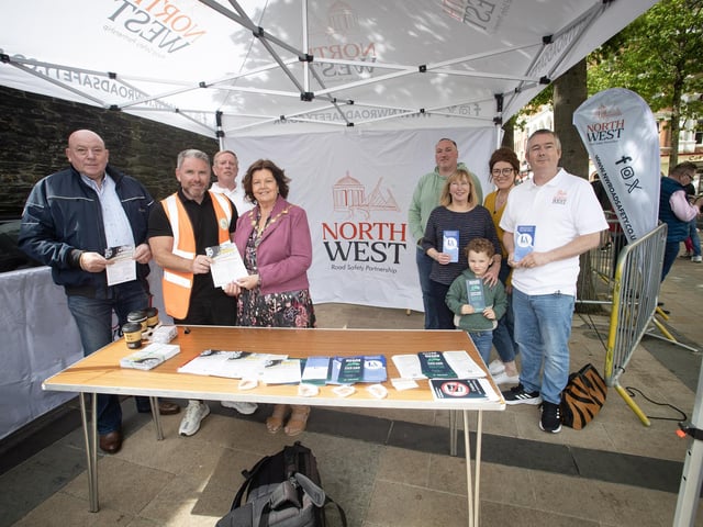 NW ROAD SAFETY PARTNERSHIP. . . .The Mayor, Patricia Logue pictured at the North West Road Safety Partnership stall during Saturday's Supercar Rally in Guildhall Square. Included from left are Sandy Arthur, chair, NWRSP, Gary McCaul, event organiser, Philip McKinney, Chris Arthur, Ann Sherrard, Stephanie Burn, Rudi Burn and Chris Sherrard. (Photos: JIm McCafferty Photography)