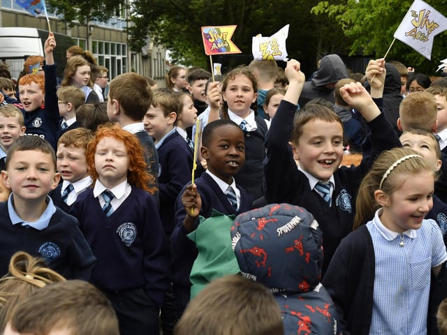 Happy pupils from Rosemount Primary School enjoy the entertainment from the Jive Aces on Thursday morning. Photo: George Sweeney