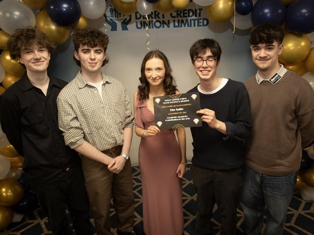 Derry Credit Union's Young People's Awards 2025 nominees 'The Suite', St. Columb's College, being presented with their certificate by Ellen Bradley, Youth Committee, on Monday night.