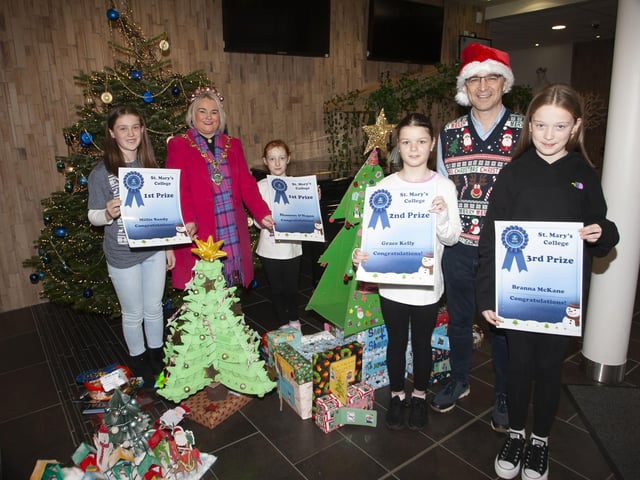 Mr. Brendan McGinn, Principal, St Mary’s College and the Mayor Sandra Duffy pictured with St. Mary’s Craft Fair competition winners on Saturday. On left are joint 1st winners Millie Sandy, St. Patrick’s PS and Shannon O’Hagan, Holy Child PS, and on right Grace Kelly, Holy Child PS, 2nd, and Branna McKane, Sacred Heart PS, 3rd.