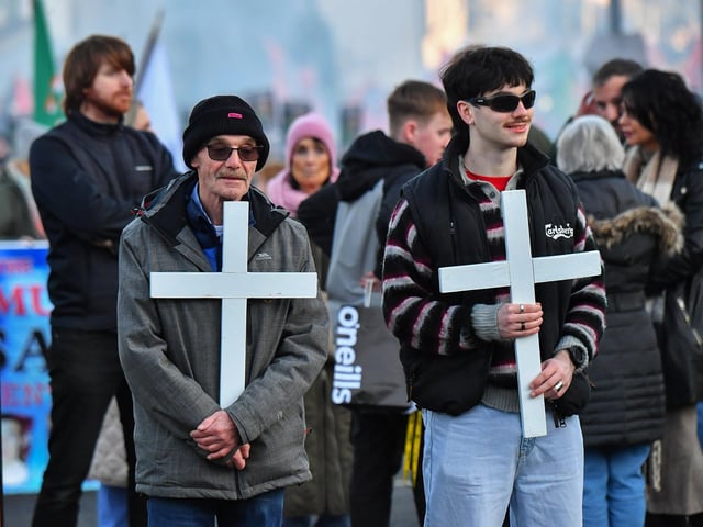 Relatives carry white crosses during the annual Bloody Sunday march. Photo: George Sweeney