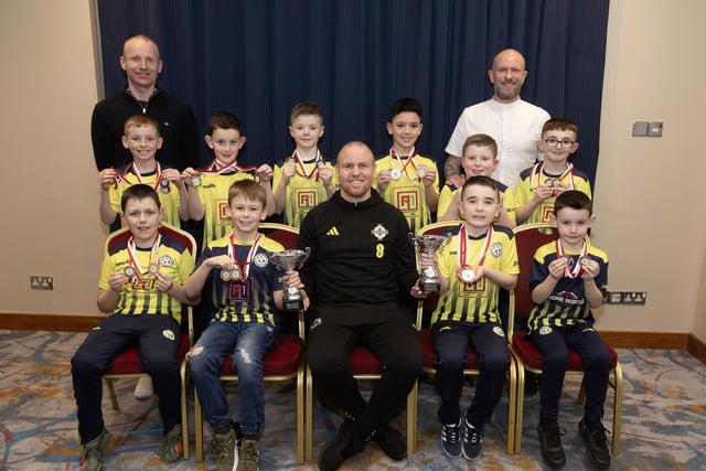 Ronan O'Donnell, Irish Football Association, special guest at the D&D Youth FA Annual Awards at the City Hotel on Friday night presents Sion Swifts Falcons U8s with the Summer and Winter Cups. Included are coaches Stephen Conroy and Sean O'Reilly. (Photos:  Jim McCafferty Photography)