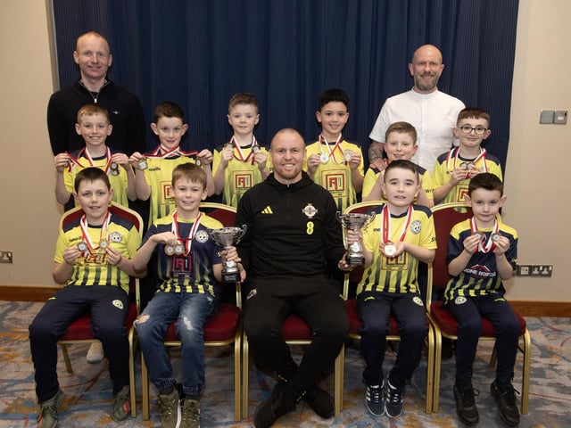 Ronan O'Donnell, Irish Football Association, special guest at the D&D Youth FA Annual Awards at the City Hotel on Friday night presents Sion Swifts Falcons U8s with the Summer and Winter Cups. Included are coaches Stephen Conroy and Sean O'Reilly. (Photos:  Jim McCafferty Photography)