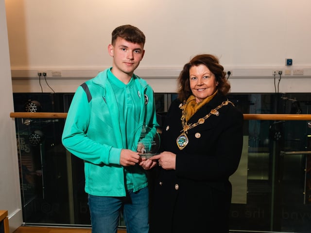 Derry City & Strabane District Council Mayor Patricia Logue making a prsentation to under 19 Ireland World Cup cricketer Gavin Roulston at a special reception in The Alley Theatre.