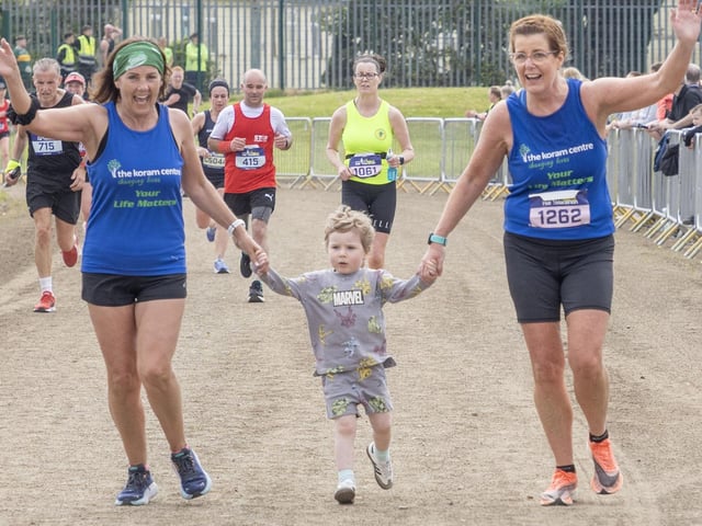 Catherine Quigley (1262) gets a helping hand coming up to the finish line. (North West Newspix)