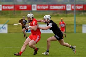 Derry’s Cormac O’Doherty, who hit 1-12, shields the sliothar from Sligo’s Niall Kilcullen during the game in Owenbeg on Sunday afternoon. (Photo: George Sweeney)