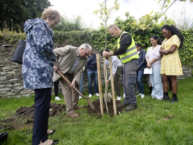 Dr. Robert Murtland plants the third tree at St. Columb's Park on saturday for the companions who tried to rescue Reuven and Joseph.