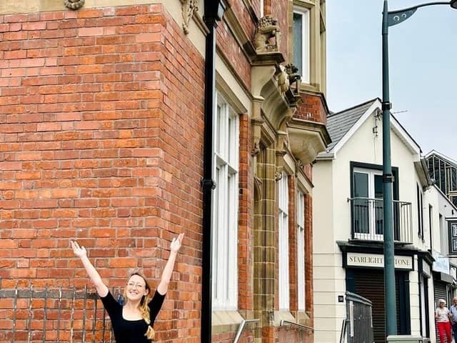 Natasha Kirke General Manager outside the SafeHouse Cafe Bar and Bank Apartments