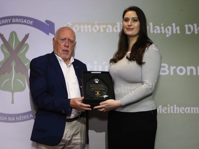 Former Republican prisioner, now author, Danny Morrison, guest speaker at the Derry Volunteers Commemoration Evening making a presentation to Aiobhin Byrne to mark the 50th anniversary of Óglach Jim Gallagher. (Photo - Tom Heaney, nwpresspics)