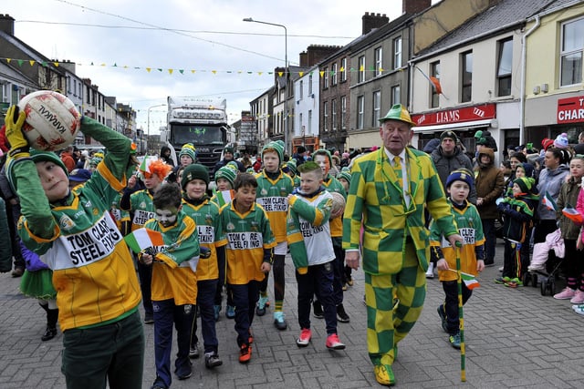 Buncrana St Patrick's Day parade and events: There will be lots of floats, bands and attractions around Inishowen's largest town for the festivities this year. There will kids' activities before and after the parade, while pubs are hosting live music, and there will be band playing in the Market Square from 1pm to 2.30pm ahead of the parade setting off at 3pm along the usual route. Pictured at a previous Buncrana St Patrick's Day parade are John Porter (right) with young Buncrana GAA players.  DER1118GS028