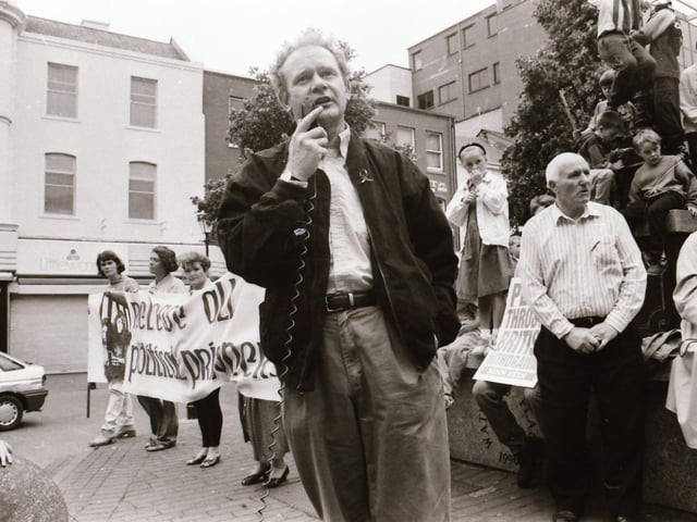 Sinn Féin's Martin McGuinness, Mary Nelis and other party members leading protests calling for all party peace talks.