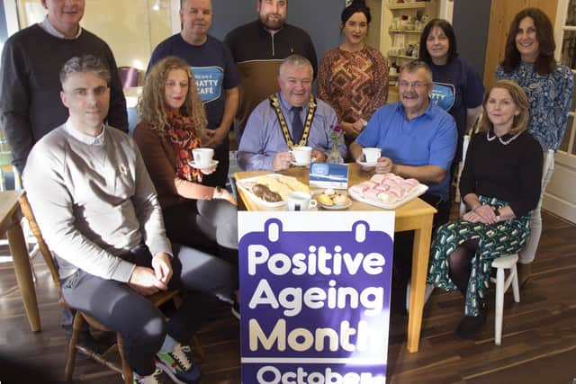 Pictured at the launch of the Chatty Café at Curran’s Bakery and Coffee Shop in Greysteel are front row (L-R) Liam Hinphey, Age-Friendly Co-ordinator, Catherine Farrimond, Community Development Officer, the Mayor of Causeway Coast and Glens Borough Council, Councillor Ivor Wallace, coffee shop customer Davie and Gabrielle Quinn, Causeway Coast and Glens Council Loneliness Network. Back row (R-L): Maureen Duffy, GP Federation Western Trust; Siobhan Curran, Coffee Shop owner, Tori Calderwood, COAST & Causeway Loneliness Network, Columba Mailey, Vale Centre Manager, Felim Curran, coffee shop owner and Councillor Dermot Nichol.