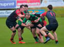 City of Derry’s Jack Beattie is hauled to the ground by Limavady players at Judges Road on Saturday afternoon last.  Photo: George Sweeney.  DER2239GS – 094
