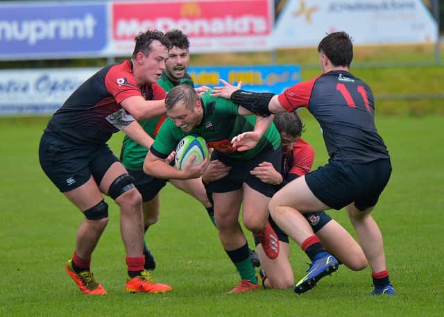 City of Derry’s Jack Beattie is hauled to the ground by Limavady players at Judges Road on Saturday afternoon last. Photo: George Sweeney. DER2239GS – 094