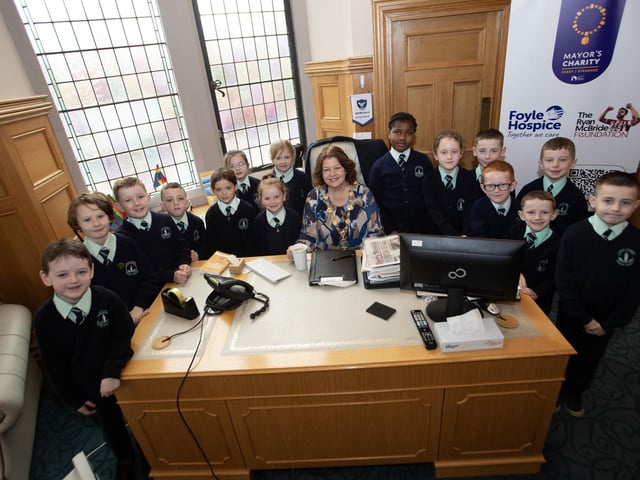 The Mayor of Derry City and Strabane District Council, Patricia Logue pictured in the Mayor's Parlour with pupils from the Long Tower Primary School during their Democracy Week visit to the Guildhall on Thursday morning. 