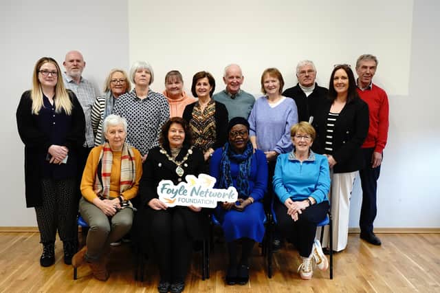 Staff, volunteers, members and representatives of partner organisations with the Mayor Patricia Logue at the Foyle Foodbank AGM on Monday when the organisation rebranded as the Foyle Network Foundation.