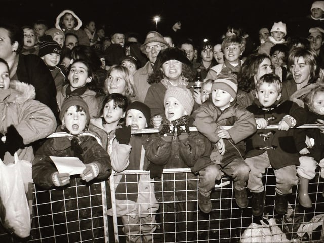 Crowds watch as Mayor and Mayoress of Derry, John and Carita Kerr switch on the Christmas lights with a little help from Spider Man and the Power Rangers.