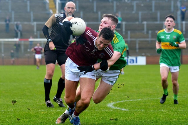 Slaughtneil’s Christopher Bradley is tackled by Glen’s Ethan Doherty during the Derry SFC final at Celtic Park on Sunday afternoon.  DER2243GS - 007