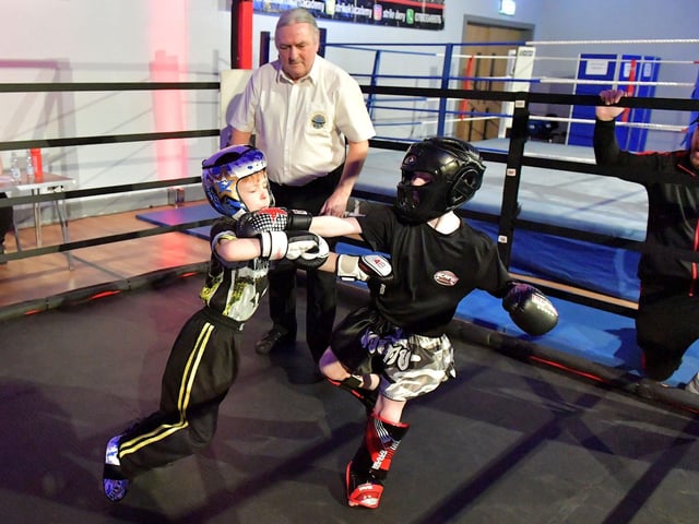 Oisin O’Hagan (left), Strike Martial Arts, takes on Andrew Lychenko, Black Dragan Cavan, in The Rising Stars event held in Shantallow Community Centre on Saturday. Photo: George Sweeney. DER2308GS – 155
