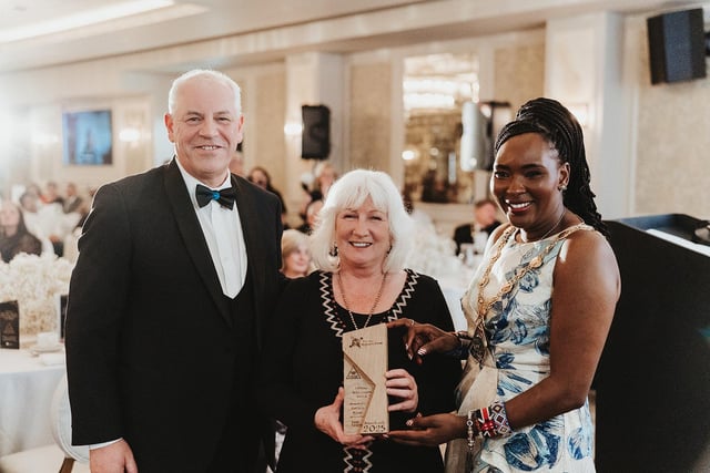Chief Executive of Derry City and Strabane District Council, John Kelpie and Mayor Lilian Seenoi Barr presenting Patricia Byrne, co-founder of Sole Purpose Productions, with her Lifetime Achievement Award.