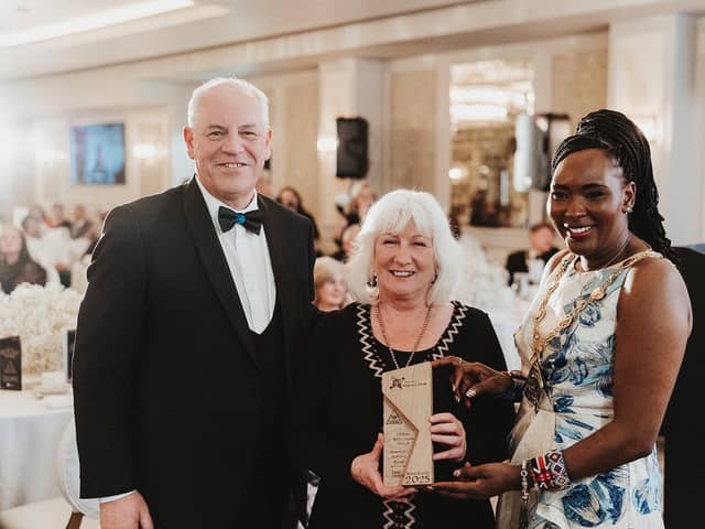 Chief Executive of Derry City and Strabane District Council, John Kelpie and Mayor Lilian Seenoi Barr presenting Patricia Byrne, co-founder of Sole Purpose Productions, with her Lifetime Achievement Award.