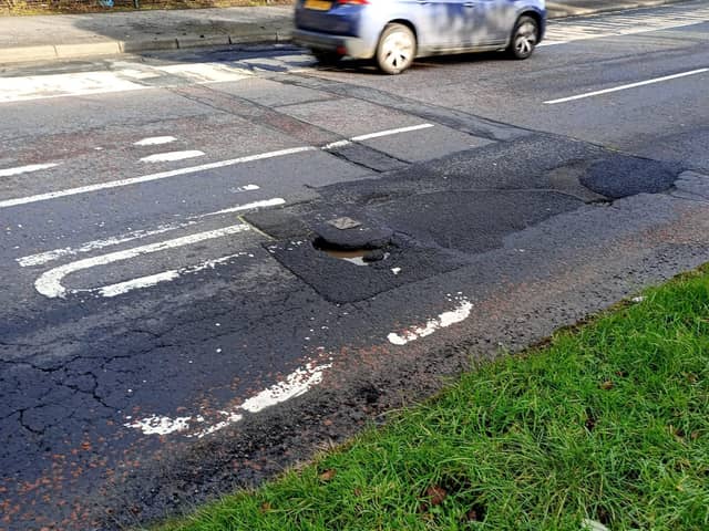 A large pothole on the Northland Road.