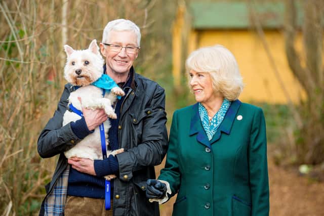 Her Majesty The Queen Consort joins  Battersea Ambassador Paul O'Grady and George the West Highland White Terrier at Battersea Brands Hatch site in Kent
