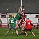 Derry and Meath hurlers battle for the sliothar. Photo: George Sweeney