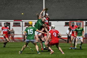 Derry and Meath hurlers battle for the sliothar. Photo: George Sweeney