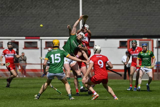 Derry and Meath hurlers battle for the sliothar. Photo: George Sweeney