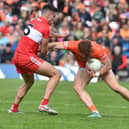 Derry's Conor Doherty gets to grips with Armagh's Jason Duffy in Clones on Sundasy. (Photo: John Merry)
