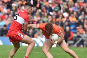 Derry's Conor Doherty gets to grips with Armagh's Jason Duffy in Clones on Sundasy. (Photo: John Merry)