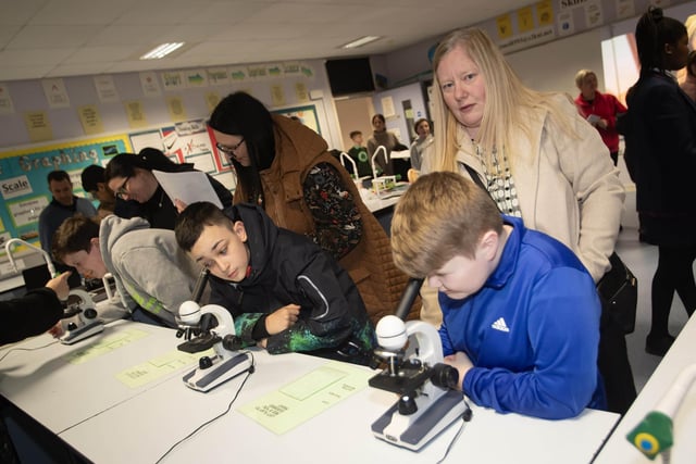Pupils and parents enjoying the 'science experience' at Oakgrove Integrated College's Open Day.
