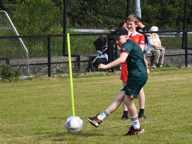 Andrew showcasing his football skills at Steelstown Sports Day.