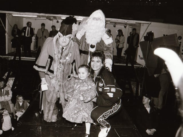 Santa, with help from TV Gladiator Falcon, also known as Bernadette Hunt, switched on the Derry Christmas lights.