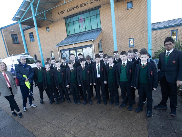 HISTORY TOUR. . . . Year 8 students from St. Joseph's Boys School pictured before leaving on a history tour of the Creggan on Wednesday under the guidance of former pupil and local historian Seamus Breslin. On left is Mrs. Fiona Harrigan, Vice Principal. (Photos: Jim McCafferty Photography)