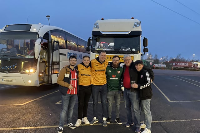 PITSTOP . . . These Derry City fans make a stop for some refreshments on their way to Dublin.