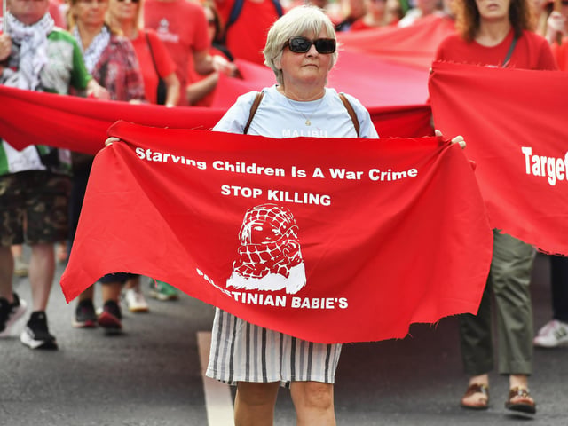 The ‘Turn Shipquay Street Red for Gaza’ march makes its way along Bishop Street  towards Shipquay Street on Saturday afternoon. Photo: George Sweeney