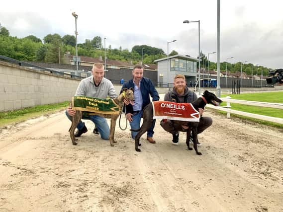 Portrush Tootsie and Portrush Ben pictured with Adrian McGarry (left), Andrew O’Neill from O’Neills Dog Food (centre) & Kevin Keenan (right).