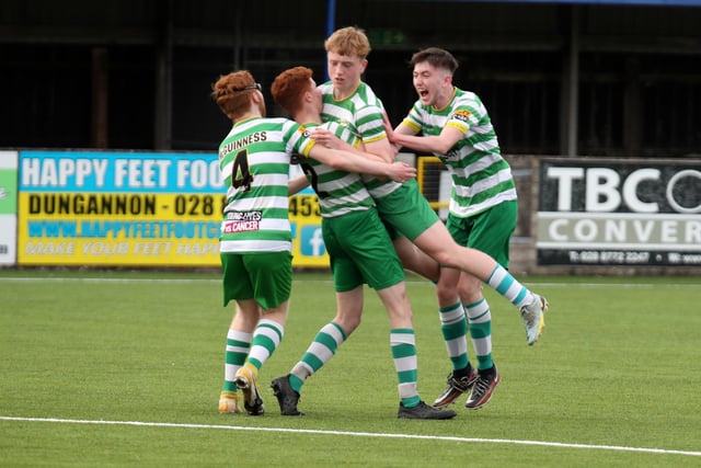 Top Of The Hill Celtic players hold up Taidhg Coyle after his free-kick regained the lead over St. Oliver Plunkett.