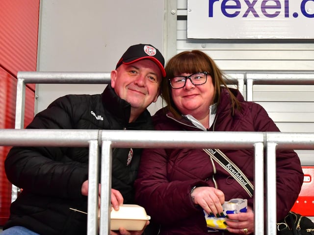These Derry City fans get a quick bite to eat before the match kicks off.