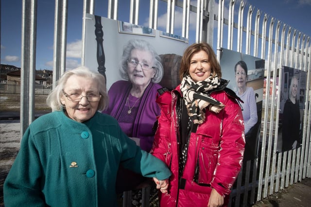 Bogside woman Mary Nelis pictured beside her portrait at Meenan Park on Monday last with Jayne Quigg, manager, Dove House Community Trust.