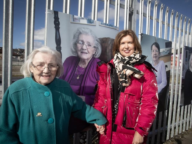 Bogside woman Mary Nelis pictured beside her portrait at Meenan Park on Monday last with Jayne Quigg, manager, Dove House Community Trust.