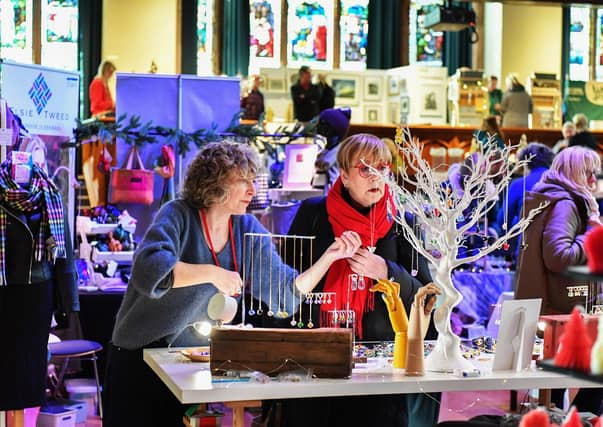 Browsing the large range of gifts availableat the Guildhall Christmas Fair. Photo: George Sweeney / Derry Journal